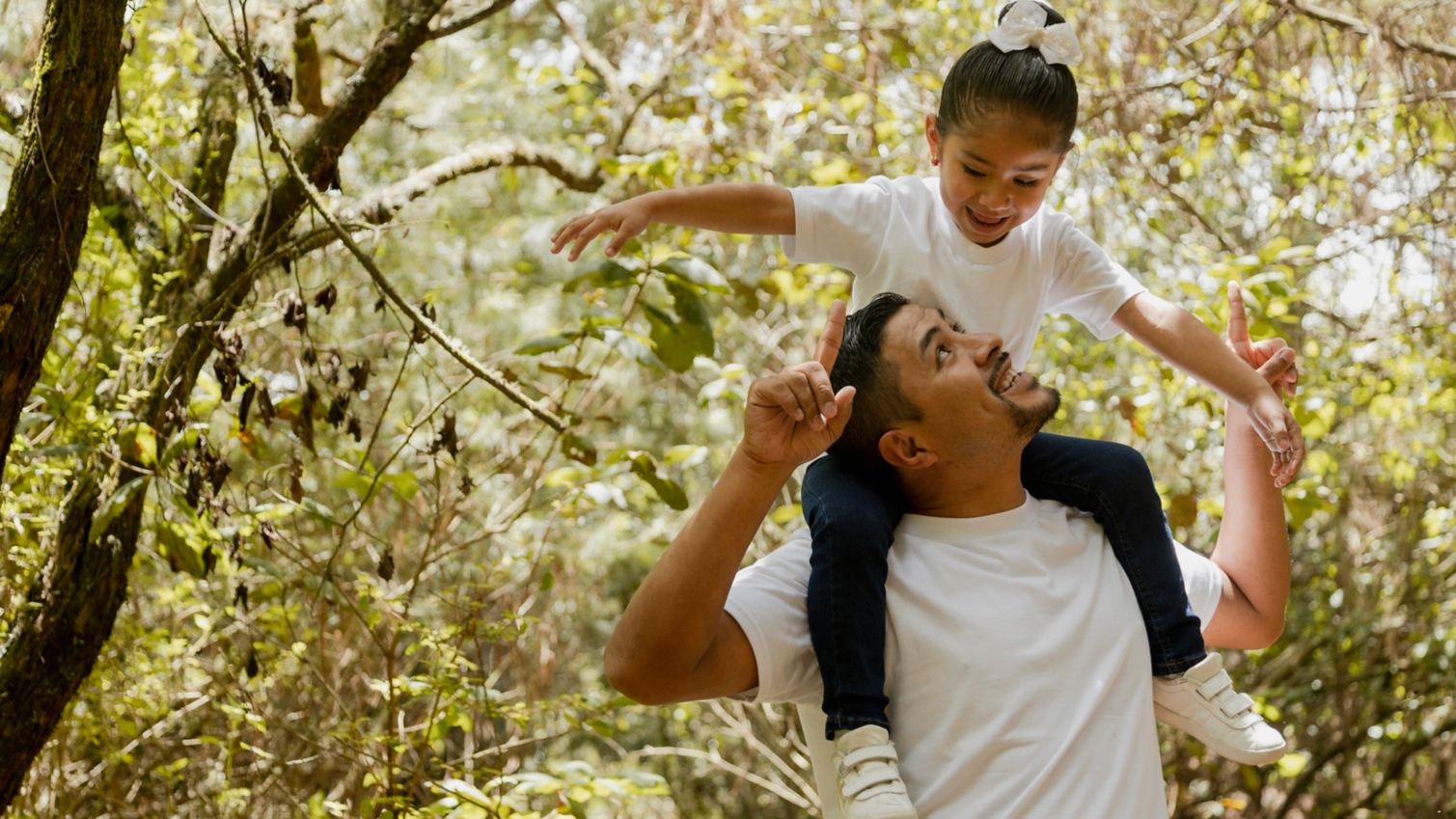 Dad and daughter play together outside